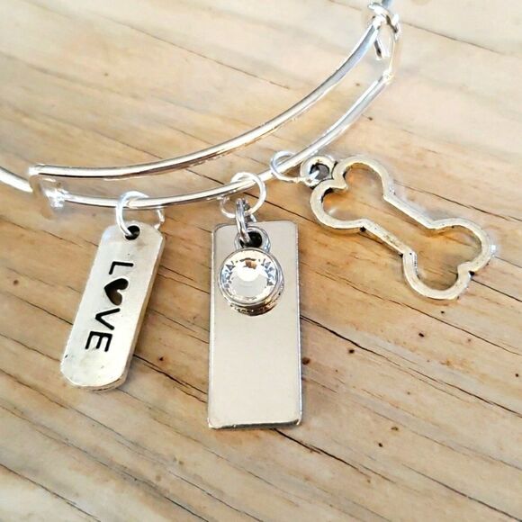 Bracelets by Sandra silver tone adjustable, dog bone - Picture 2 of 2